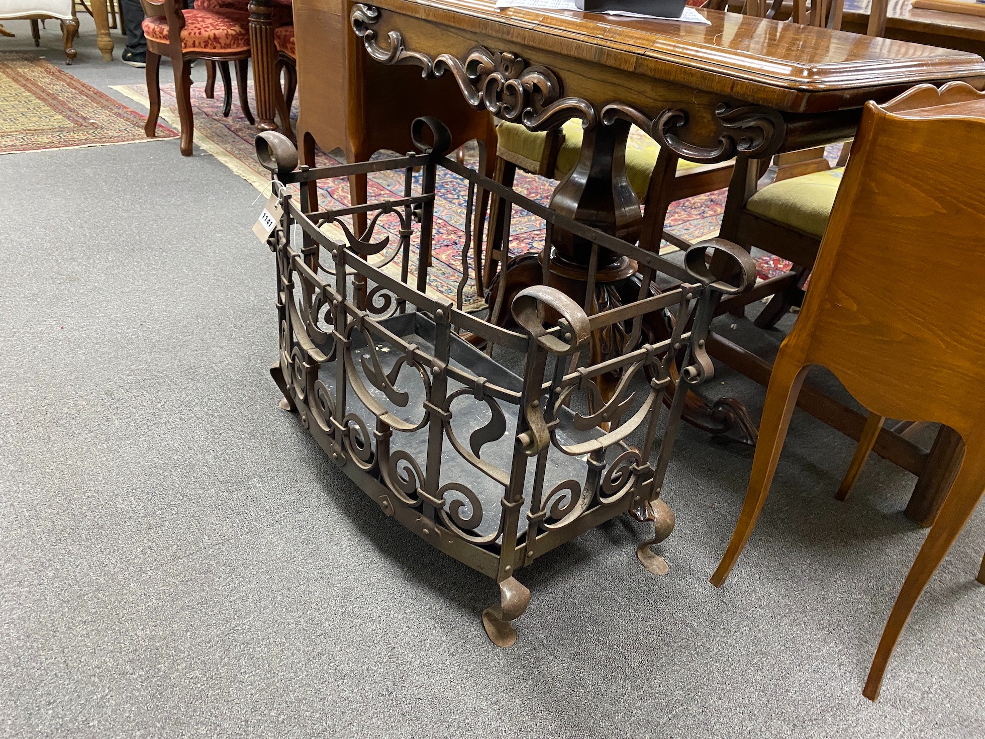 A cast and wrought iron fire grate, width 74cm, depth 35cm, height 51cm